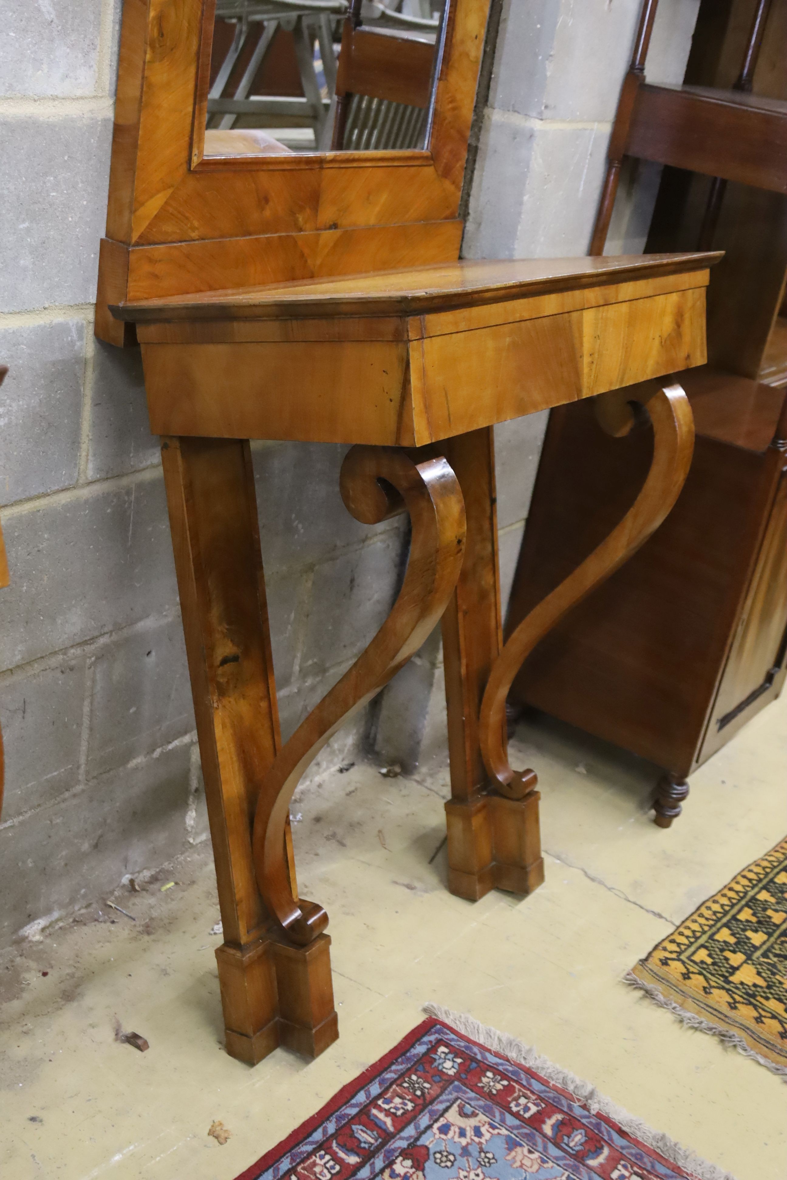 A pair of 19th century Italian mahogany pier tables with mirrors, width 72cm, depth 42cm, height 218cm